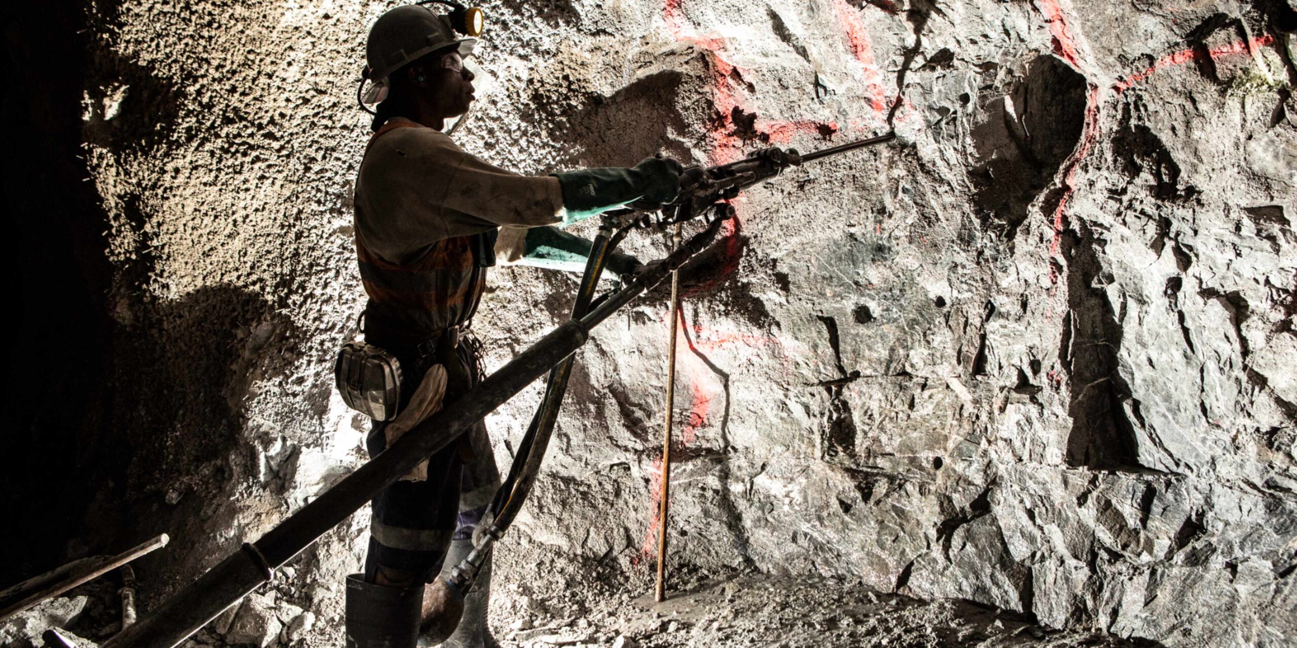 Man in coal mine wearing safety gear